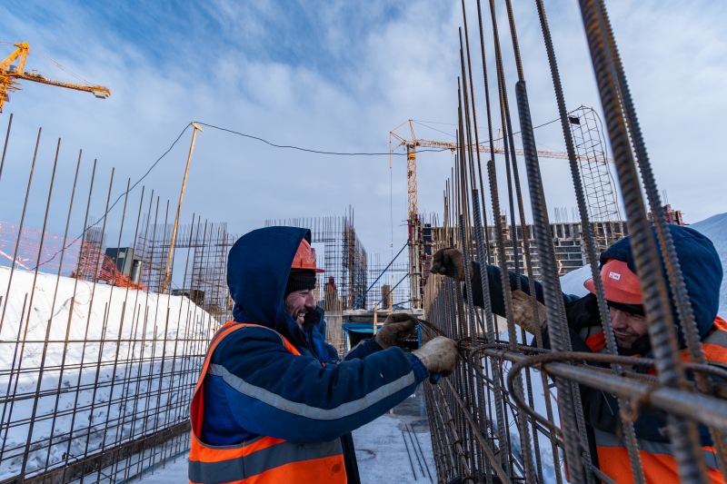 Workers install rebar for the technical floor of a dormitory building. Credit: ITMO University
